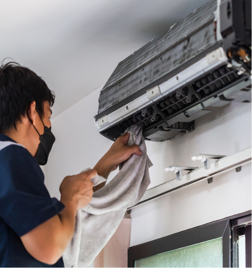 Purcell Heating and Air Ltd technician testing AC system during repair in a Calgary residential property