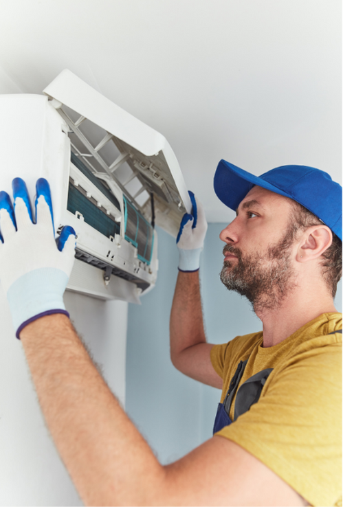 Technicians installing and repairing AC equipment for residential customers in Calgary by Purcell Heating and Air Ltd