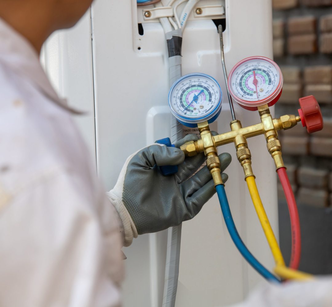 Air Conditioning Technician and A part of preparing to install new air conditioner. Technician vacuum pump evacuates and checking new air conditioner Air Conditioning Technician and A part of preparing to install new air conditioner. Technician vacuum pump evacuates and checking new air conditioner