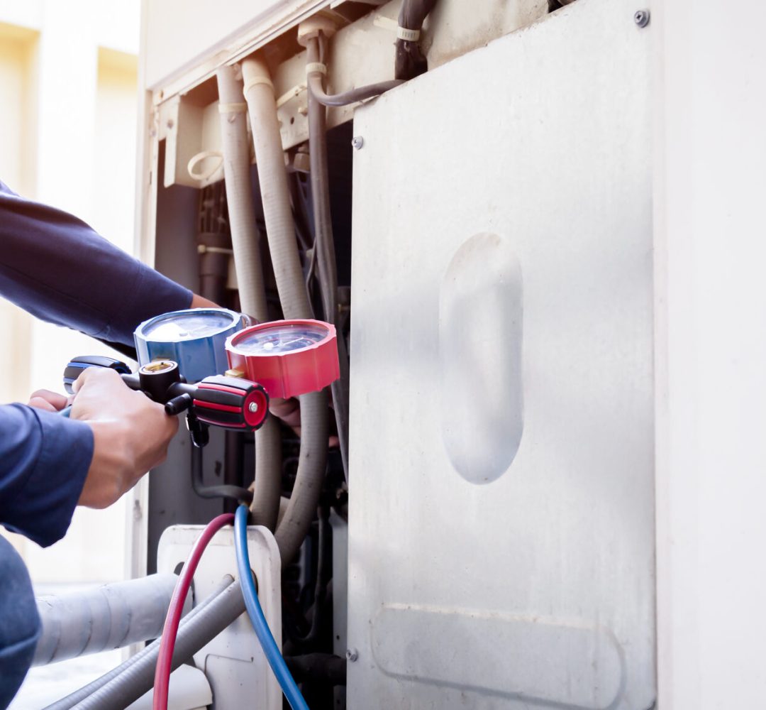 Technician is checking air conditioner ,measuring equipment for Technician is checking air conditioner ,measuring equipment for filling air conditioners.
