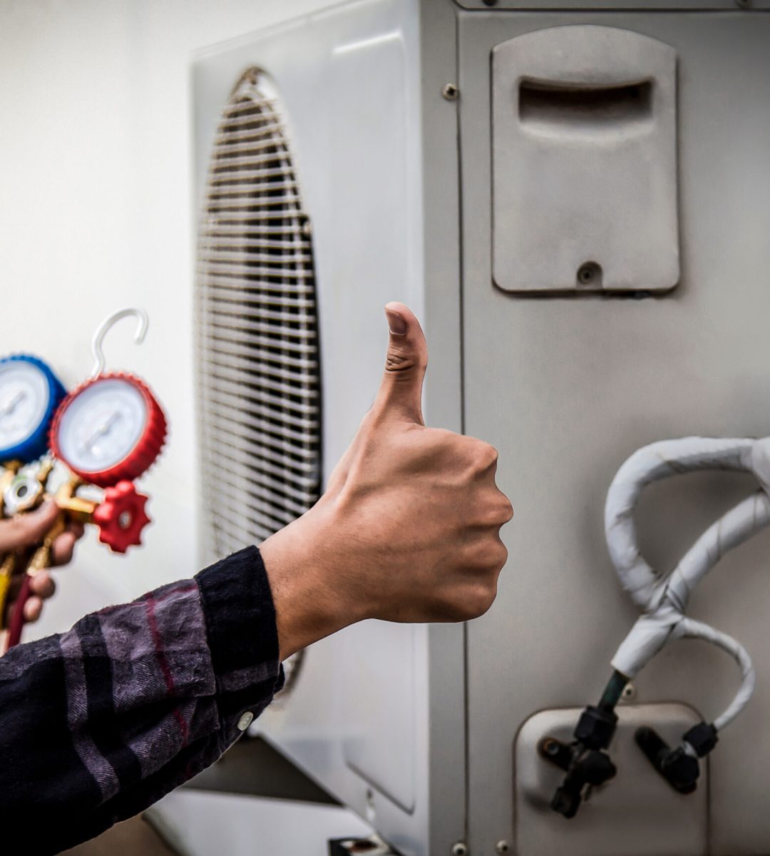 Air conditioner technician checking air conditioner operation Air conditioner technician checking air conditioner operation