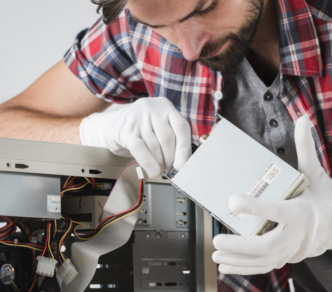 technician-inserting-sata-data-cable-hard-disk-drive technician-inserting-sata-data-cable-hard-disk-drive